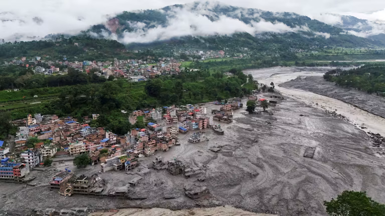 Flood damage and swollen river in Nepal's Rasuwa district after the Bhote Koshi flash flood - Nepal flood warning
